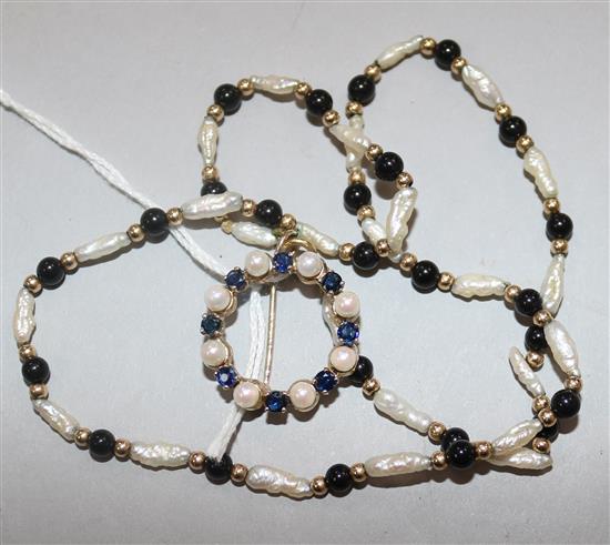 A 9ct gold, cultured pearl and sapphire circular brooch and a 9ct gold, baroque pearl and onyx bead necklace.